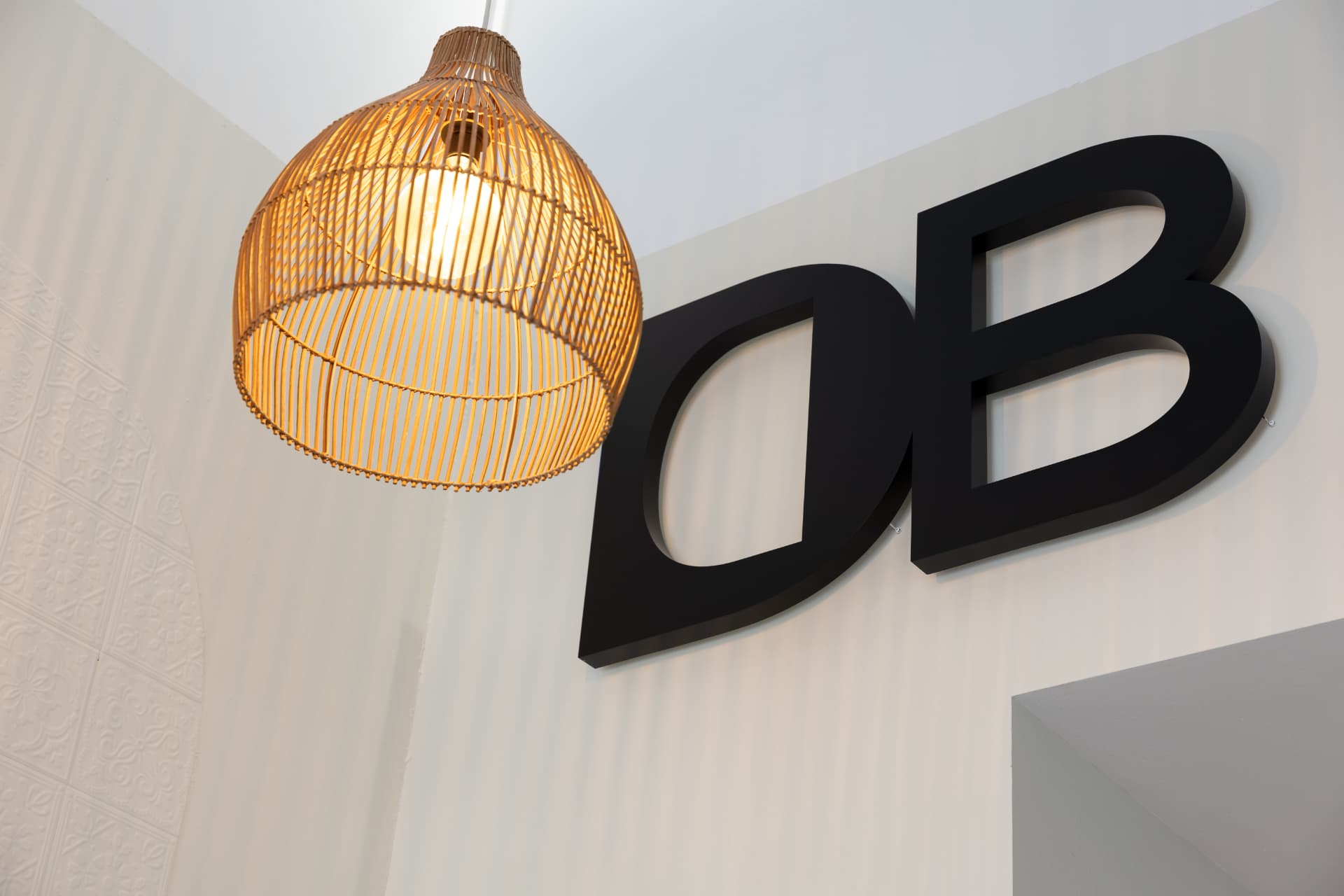 Rattan pendant light and DB letters inside Daily Blend