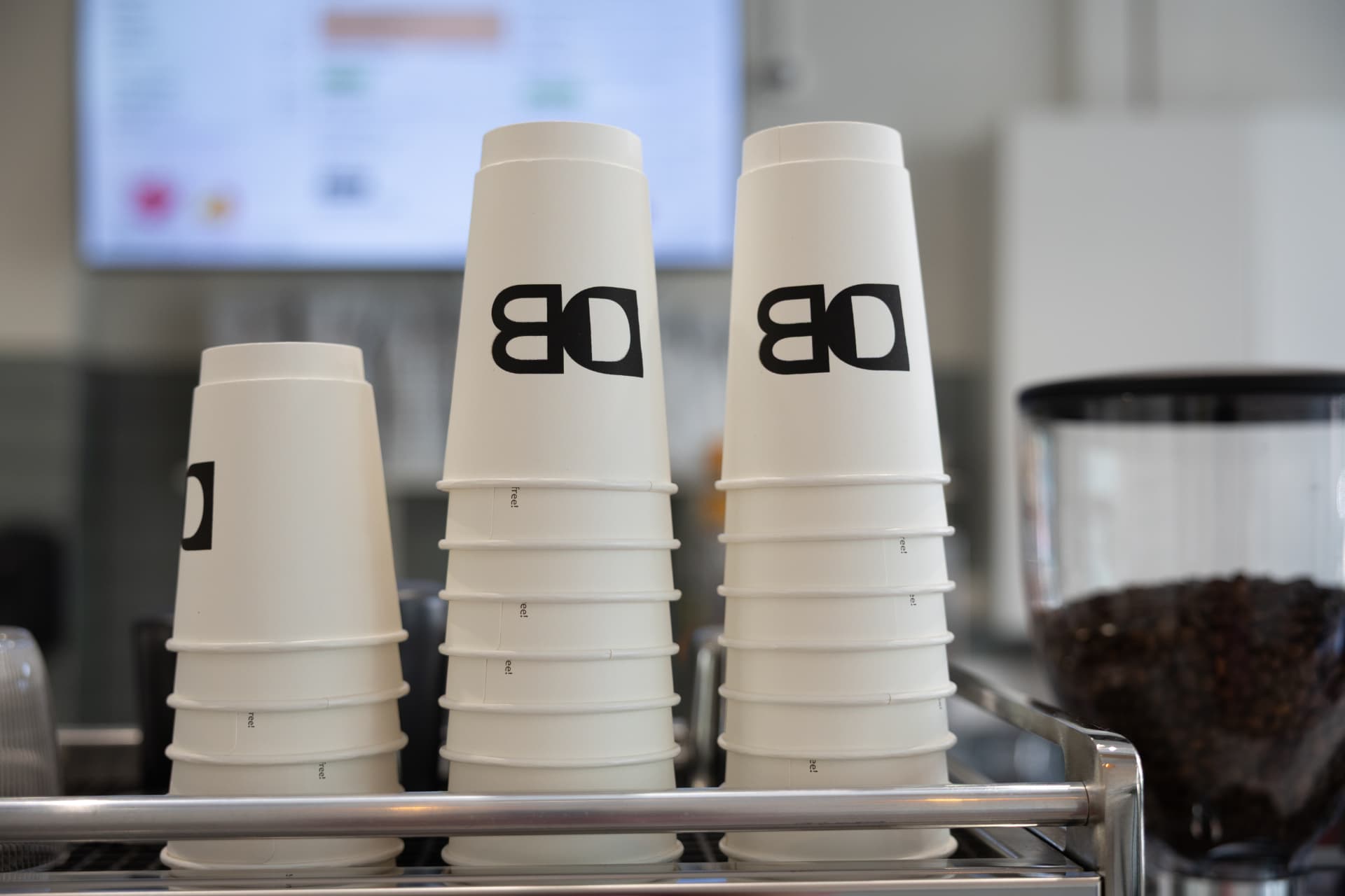 Daily Blend branded coffee cups